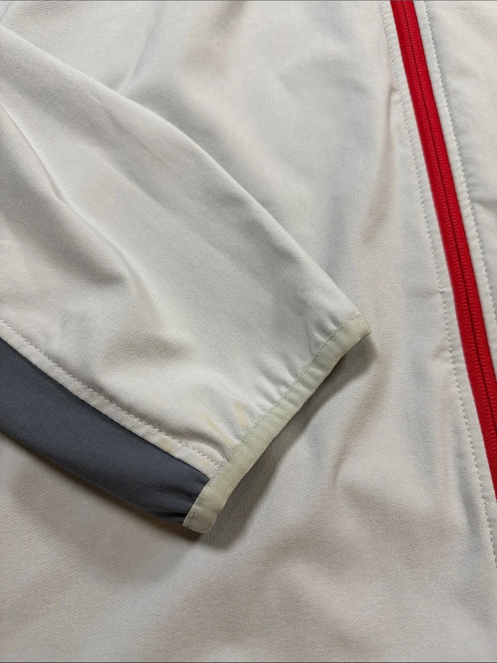 The North Face Men’s Gray Jacket with Red Zipper